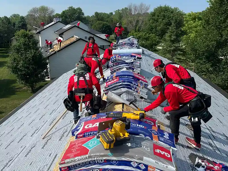 Sonntag Roofing installing new shingles on multiple residential roofs